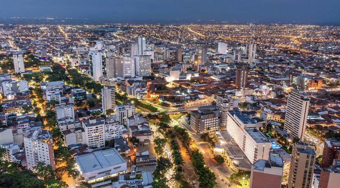 Cali, Colombia at night, city lights spread toward the mountains