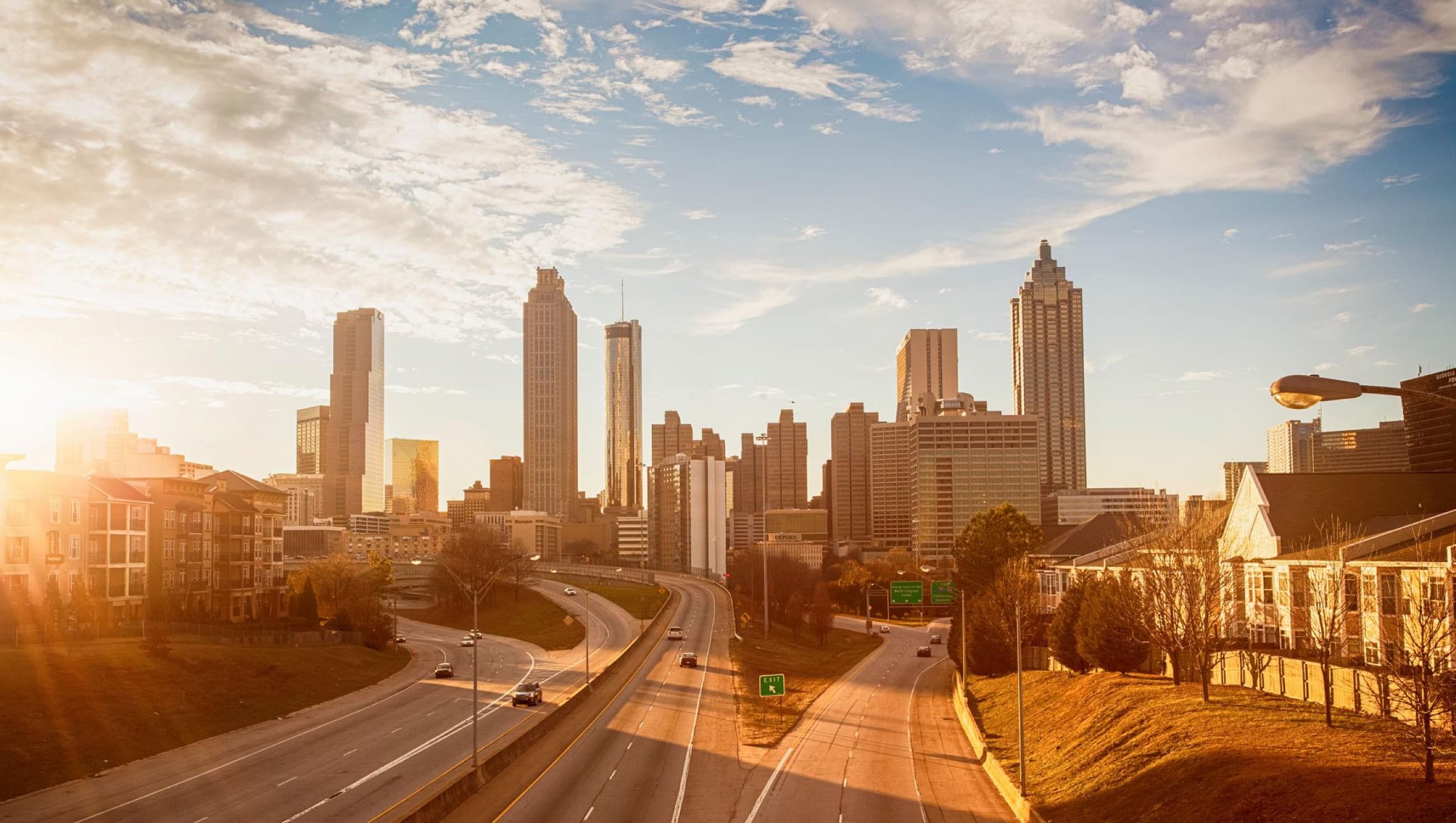 Commercial towers and regional infrastructure in warm evening light