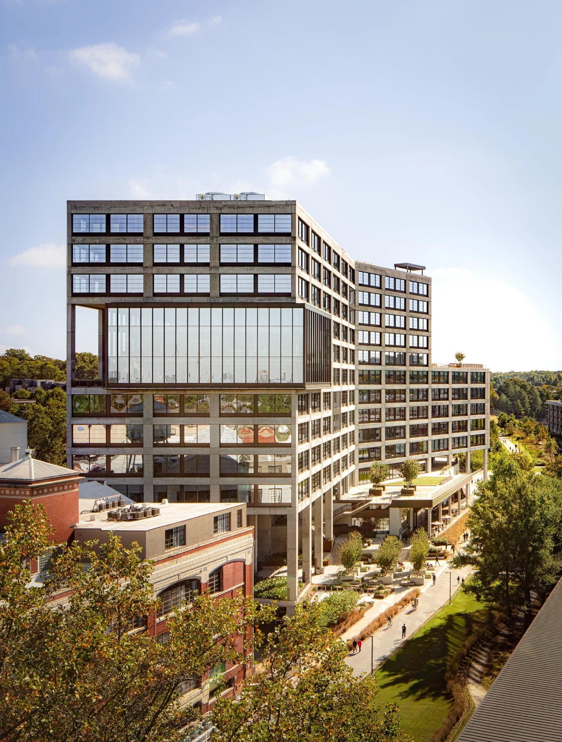 An urban campus and public realm seen from its landscaped edge