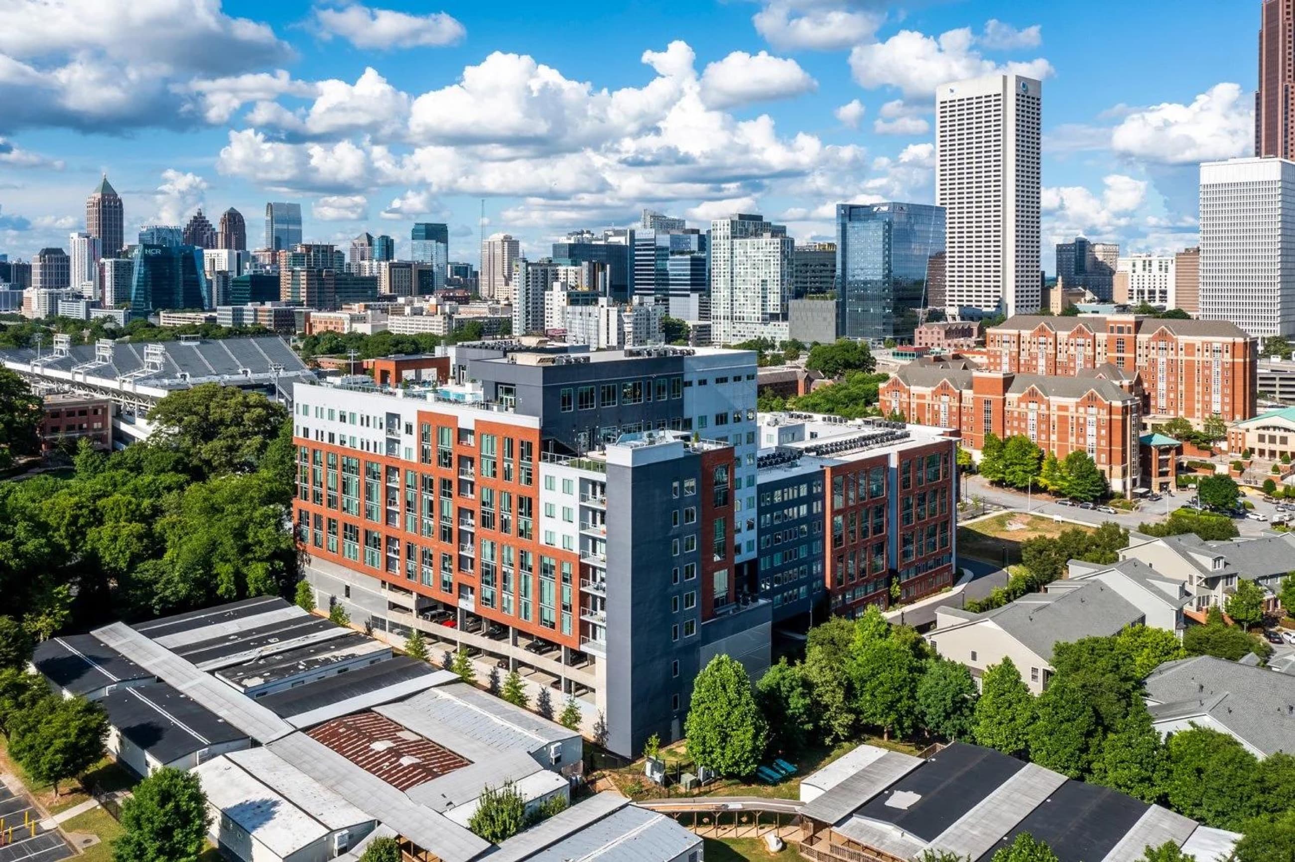 A mixed-use residential district connected to a city skyline